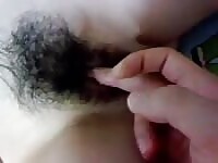 Amateur Korean's hairy pussy sees some action